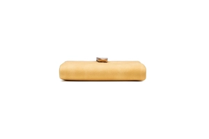 Detail view of ginger yellow retro frosted leather clutch with minimalist metal clasp closure