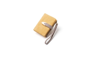 Macro shot of compact yellow frosted leather wallet with grey snap closure and silver buckle
