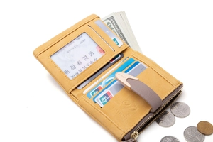 Detailed view of yellow matte wallet interior with card slots and zipper coin pocket