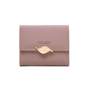 Detail of dusty pink tri-fold wallet featuring a golden leaf buckle and logo print
