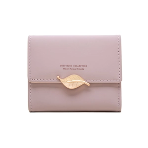 Close-up of pink faux leather trifold wallet with gold leaf buckle and neat stitching