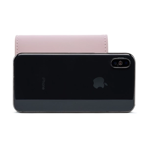 Pink trifold wallet size comparison with a smartphone showing compact leather design