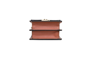 Detail view of caramel brown phone bag showing double compartments and stitching