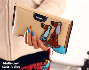 Close-up of beige long wallet featuring love lettering and a cute cartoon dog motif