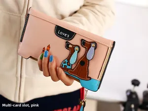 Close-up of pink long wallet with multi-card slots and cute cartoon dog design