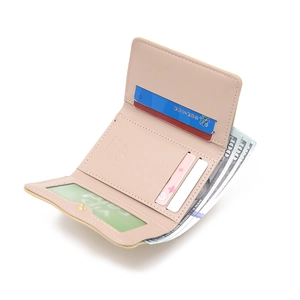 Detail view of pink PU leather tri-fold wallet showing card slots and cash pocket