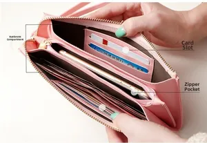 Pink faux leather wallet interior with cash compartments, card slots and zipper pocket