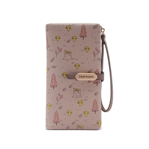 Close-up of the forest theme pattern and logo metal plate on the long PU leather wallet