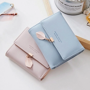 Short tri-fold women's PU leather wallet in pastel colors with metal leaf pendant