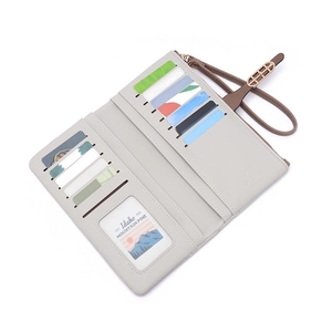 Detailed interior of light grey long leather wallet showing 11 card slots and wrist strap