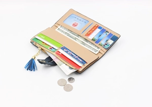Inside view of a long leather wallet with multi-card slots and a blue tassel zipper
