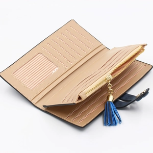 Women's vintage beige leather wallet with multi-card slots and blue tassel detail