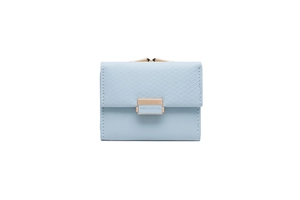 Detail of light blue tri-fold wallet with diamond lattice pattern and golden clasp