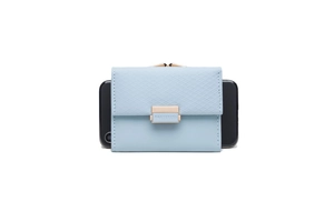 Light blue tri-fold wallet with cross-grain texture and gold clasp, size compared to phone