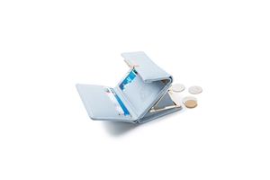 Detail view of light blue tri-fold wallet showing card slots and metal clasp coin pocket