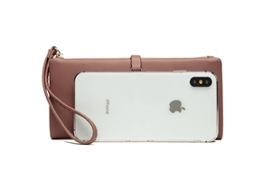 Detailed view of pink pebble grain long wallet with wrist strap and smartphone storage