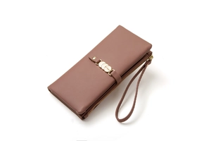 Detail of powder pink long wallet showing fine leather texture and gold hardware