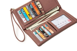 Detail view of pink PU leather wallet showing multi-card slots and zippered compartment