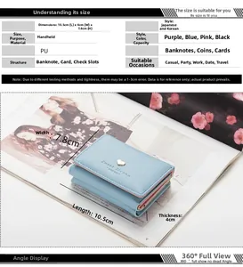 Detail view of light blue tri-fold PU wallet with heart metal buckle and card slots