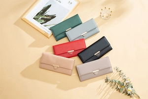 Elegant long trifold wallets for women shown in six diverse colors with heart metal clasps
