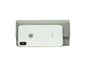 Long grey leather wallet showing large capacity size comparison with a smartphone