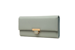 Close-up of long green wallet with gold heart buckle and smooth synthetic leather