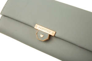 Detail of grey-green long wallet with gold buckle and precise stitching patterns