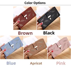 Detailed color display of long women's wallets with hollow leaf patterns and metal pendants