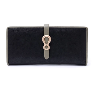 Macro shot of bicolored cross-grain leather wallet with elegant gold metal knot buckle