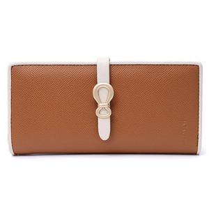 Detail of tan pebble leather long wallet with white trim and gold ring buckle closure