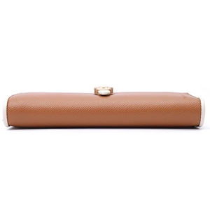 Detailed view of brown leather wallet with white edge stitching and golden clasp