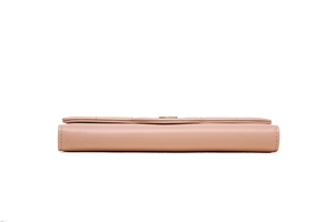 Detail view of pink quilted long wallet showing slim profile and precision stitching