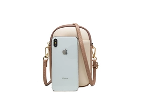 Detail view of contrast color crossbody phone bag with size reference to a smartphone