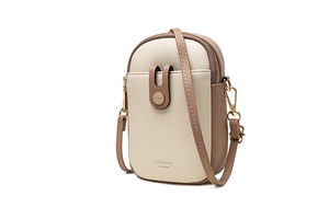 Detail view of two-tone cream and brown PU leather crossbody phone bag with gold zipper