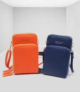 Dual-layered PU leather crossbody phone bags in orange and navy with gold zippers