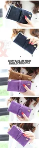 Detail view of colorful vintage frosted leather wallets with decorative strap buckles