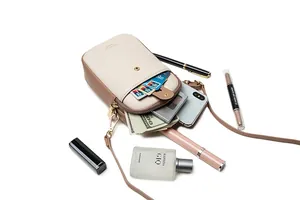Detailed top view of a bicolor PU leather crossbody phone bag with cards and small items