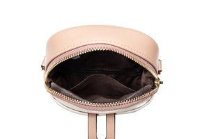 Internal view of a pink leather crossbody phone bag with deep brown fabric lining