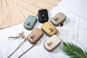 Detailed arrangement of mini crossbody phone bags in various colors and lychee textures