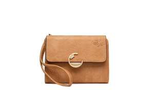 Detail of camel frosted leather wallet featuring embossed flower and gold C-buckle
