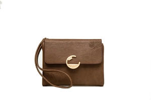 Close-up of brown textured leather wallet with gold metal buckle and floral embossing