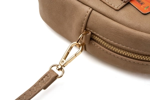 Close-up of brown textured leather phone bag with gold zipper and functional card slot
