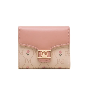 Close-up of pink and beige patchwork wallet with Pd letter print and floral pattern