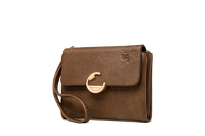 Detail of vintage brown floral embossed wallet with large gold C-clasp and wrist strap