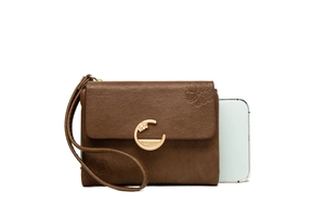 Brown litchi leather long wallet with gold C-buckle beside a phone for scale