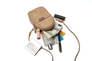 Vertical khaki matte PU phone crossbody bag showing large storage capacity for essentials
