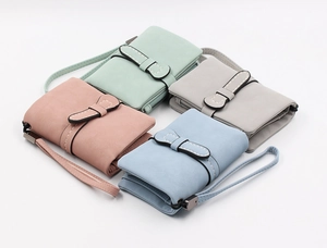 Detailed top view of multi-color faux leather wristlet wallets with side zipper closure