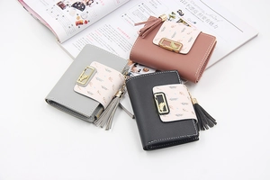 Three-fold PU leather women's short wallets with leaf metal buckle and tassel detail