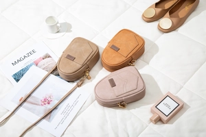 Detail view of mini matte PU leather crossbody bags with sleek metal zippers and textures