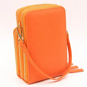 Bright orange PU leather crossbody phone bag with triple-zipper layers and gold hardware